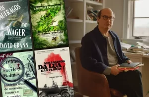David Grann ao lado das capas de seus livros, incluindo "Assassinos da Lua das Flores", "Os Náufragos do Wager" e "Z: A Cidade Perdida"